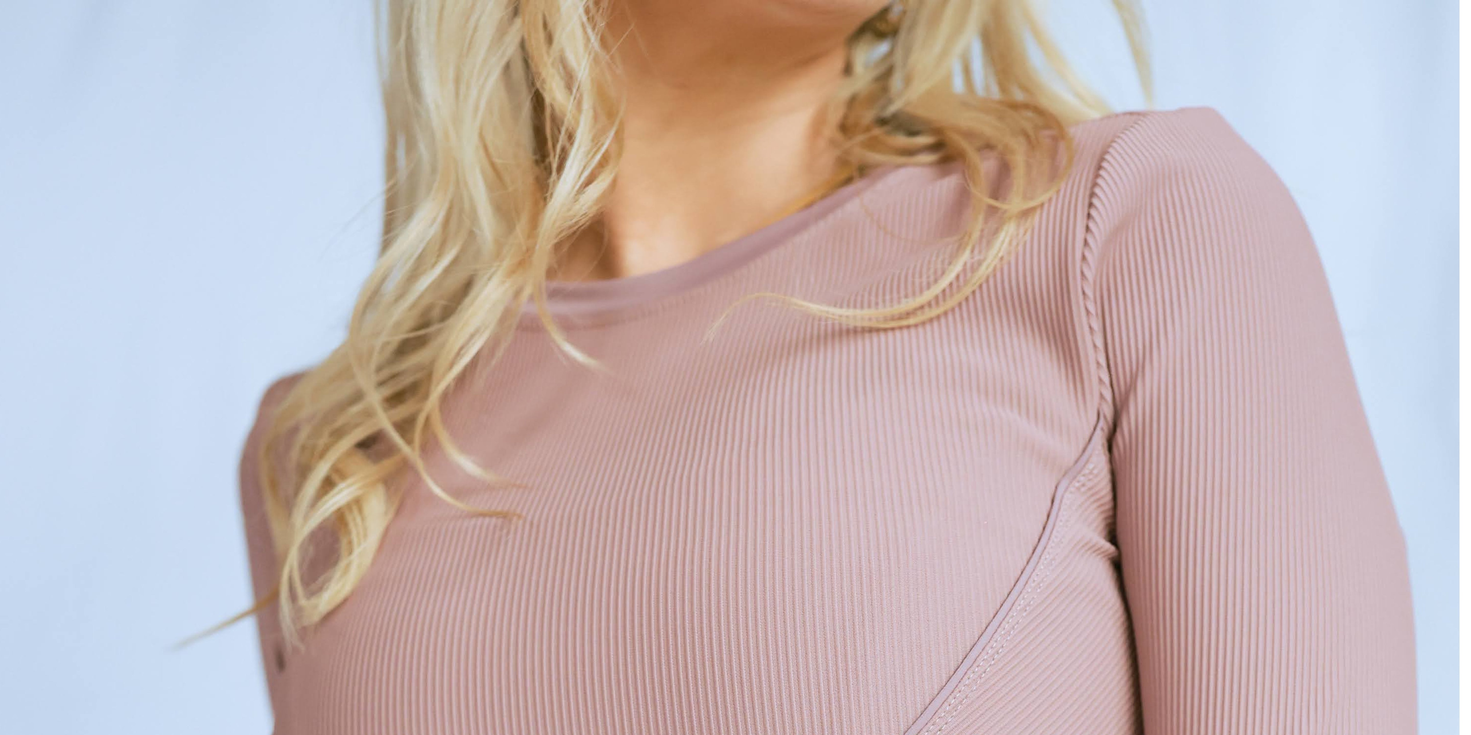 An up close picture of a model wearing the "dancing queen" top from The Sweat Society